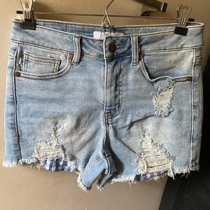 Judy Blue jean shorts. Gingham patches. Size small never worn. Light wash.